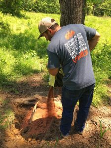 Hunter dumping out Deer Mineral at deer mineral site